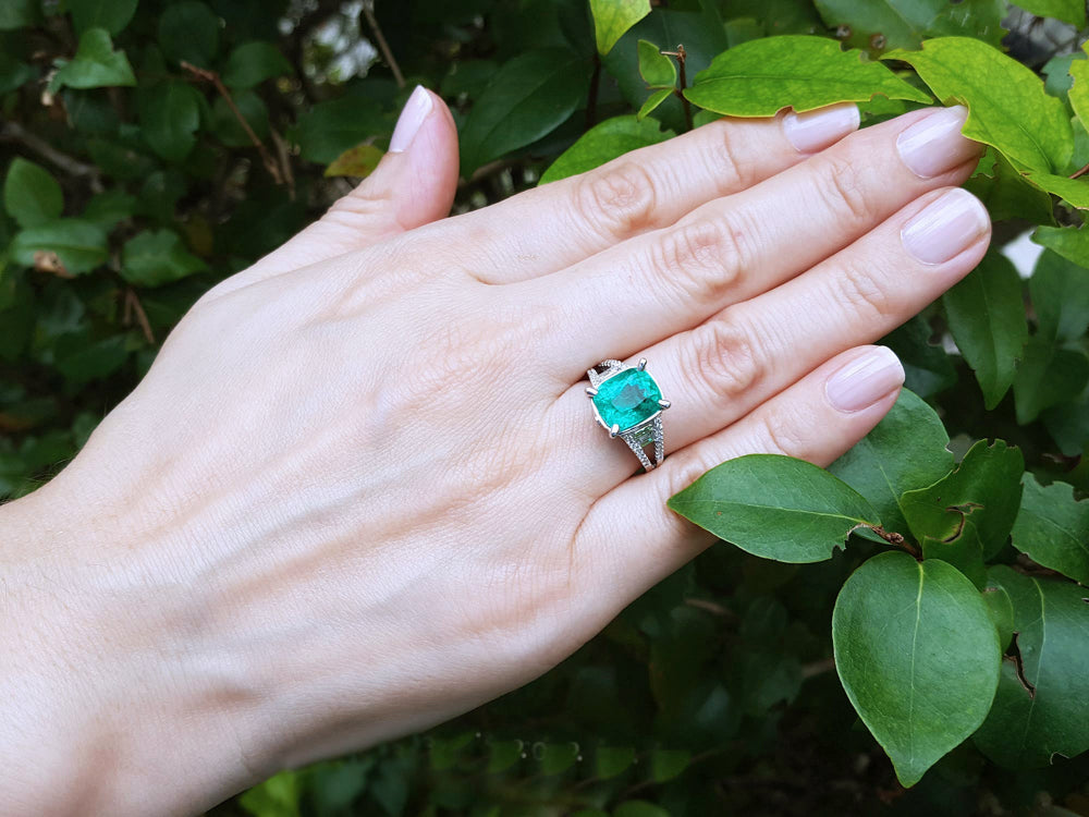 Ladies cushion cut emerald ring