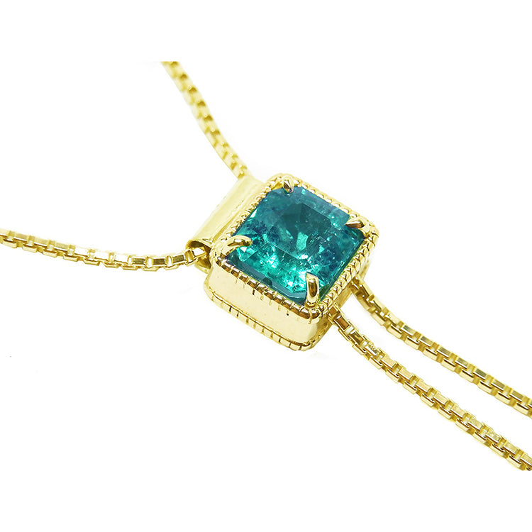Lariat emerald necklace set in 14k yellow gold sourced from the Muzo mines in Colombia weighing 1.48 carats