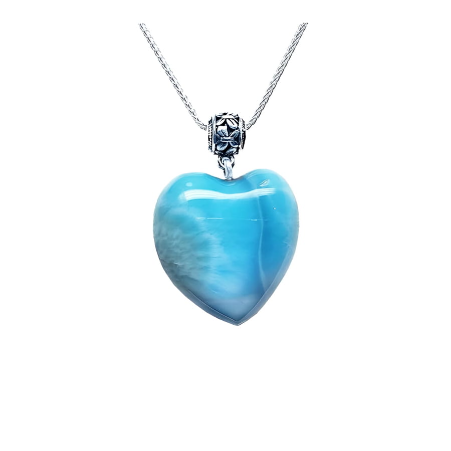 Heart-shaped blue and white larimar pendant with a decorative sterling silver bail on a silver chain.