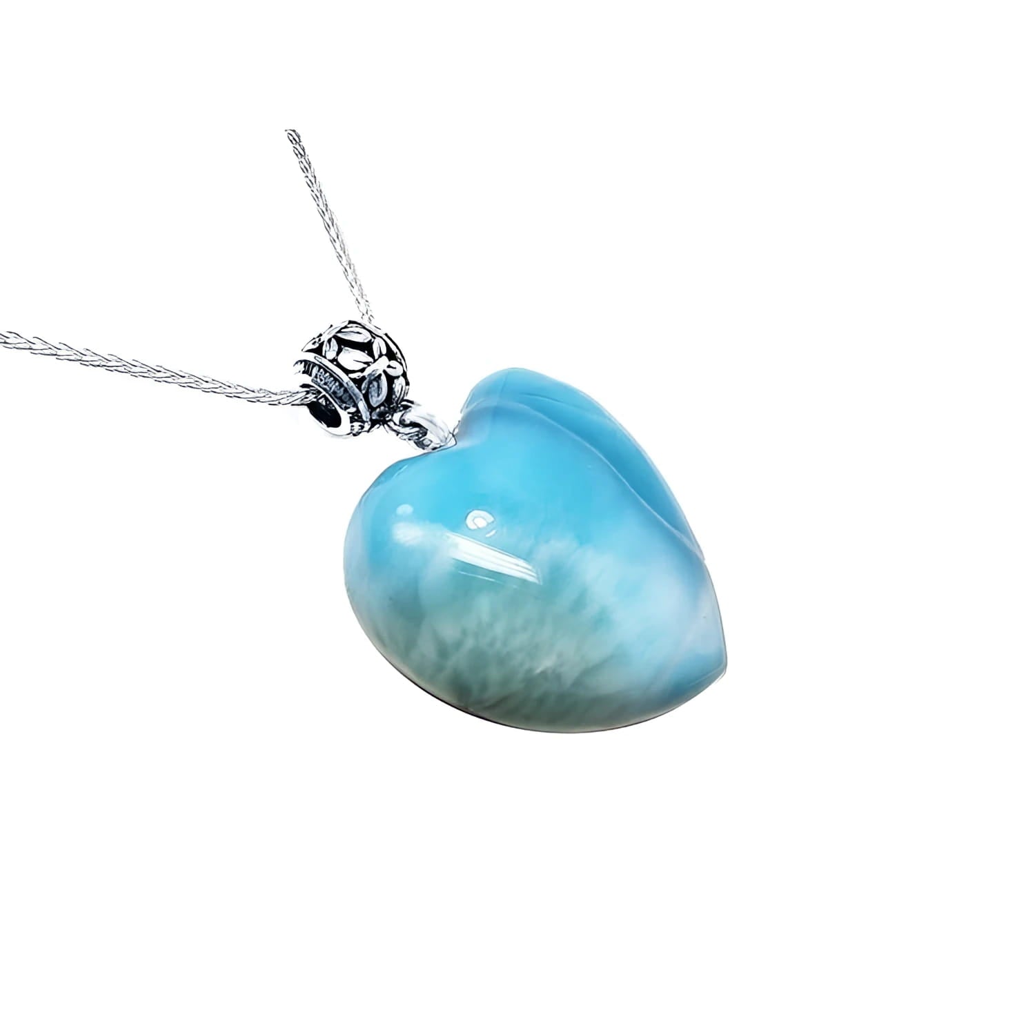 Heart-shaped blue and white larimar pendant with a decorative sterling silver bail on a silver chain.