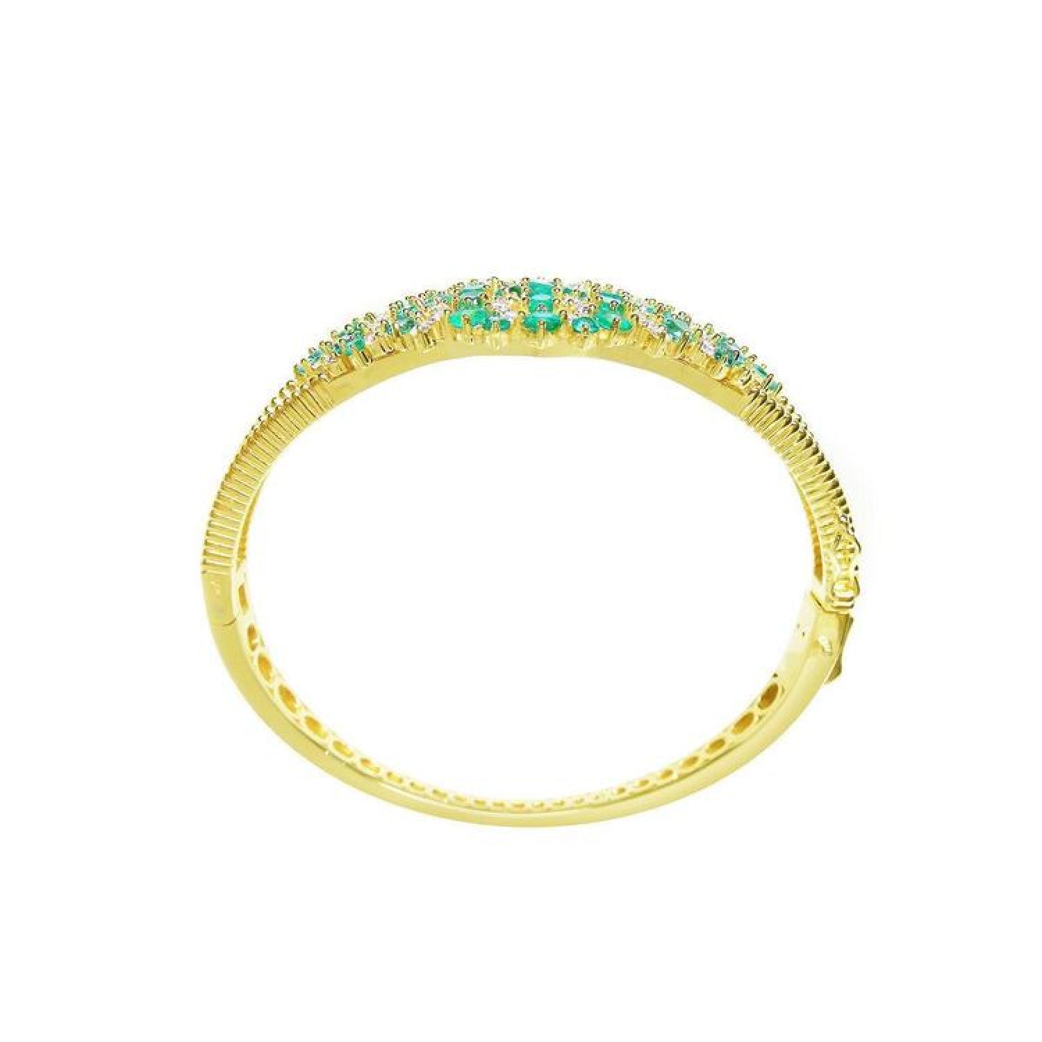 14K yellow gold bangle bracelet with round cut Colombian emeralds and diamonds in a floral design.