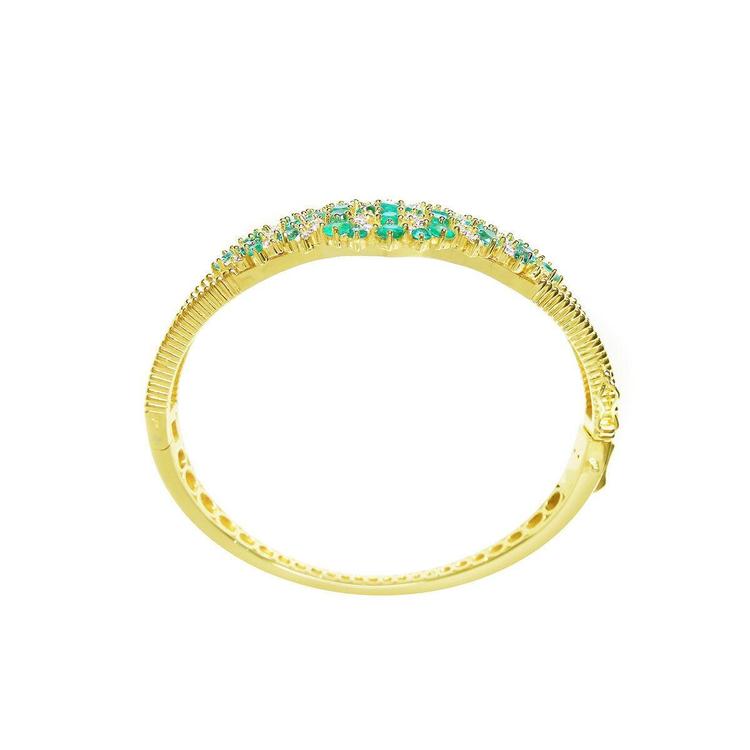 14K yellow gold bangle bracelet with round cut Colombian emeralds and diamonds in a floral design.
