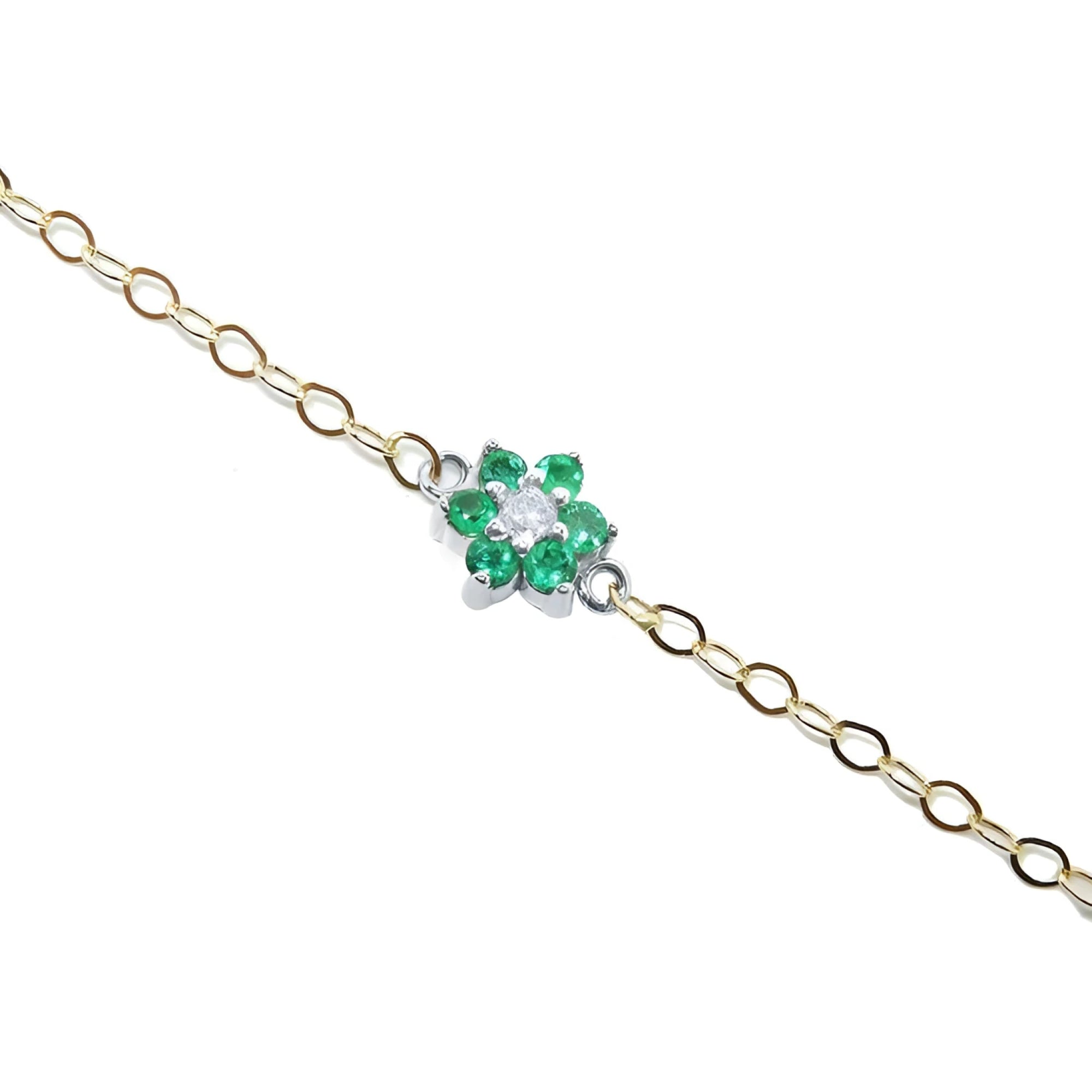 14K yellow gold chain bracelet with a central flower-shaped cluster of six green emeralds and one diamond.