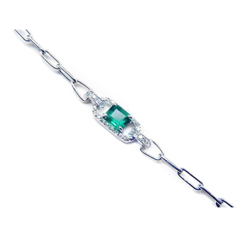 14K white gold paper clip bracelet with a square bluish-green emerald and diamond halo.