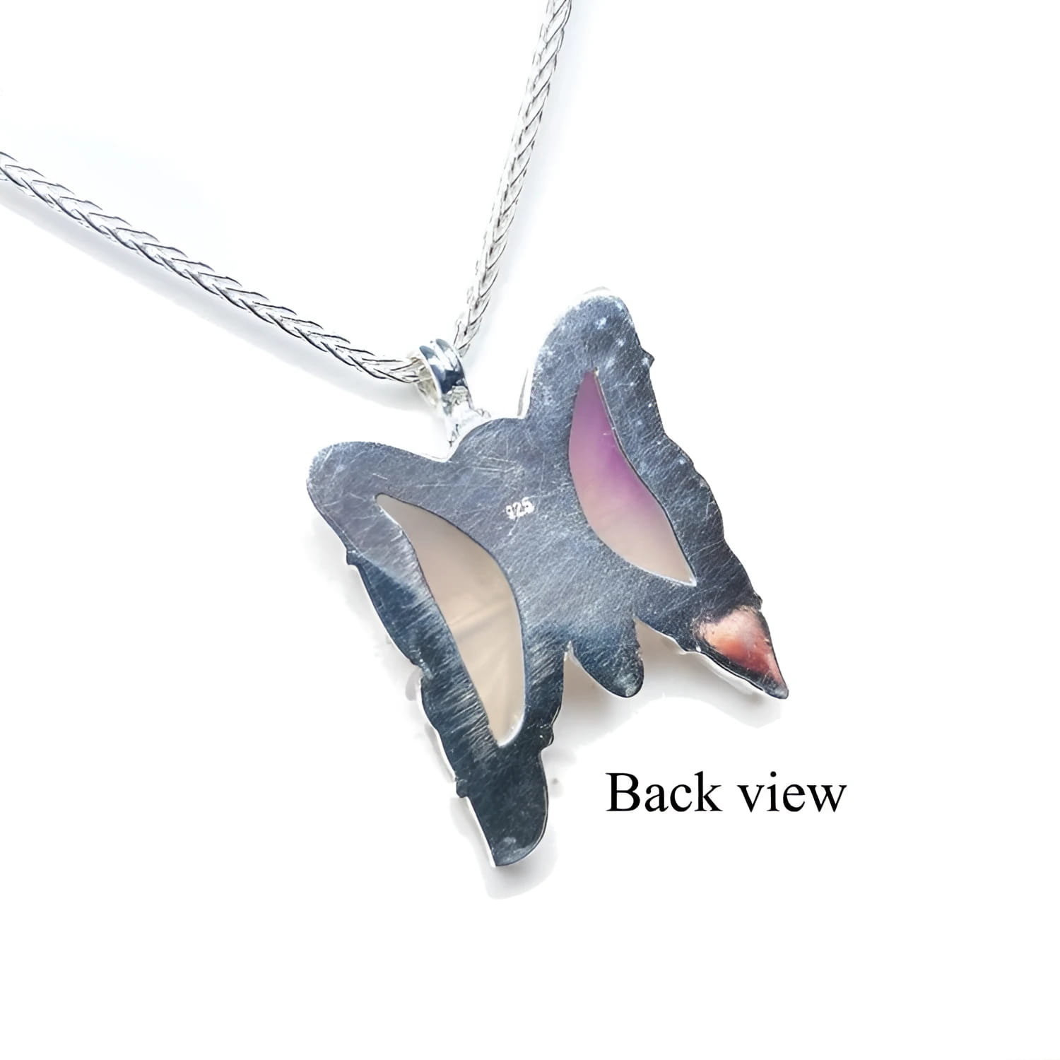 Back view of a lavender agate butterfly pendant in sterling silver on a chain.