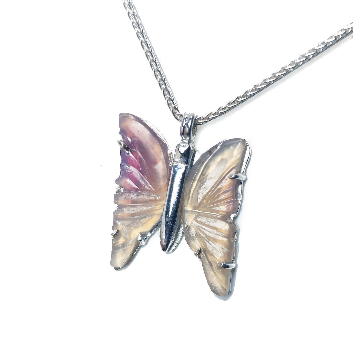 Agate butterfly-shaped sterling silver pendant on a chain against a white background