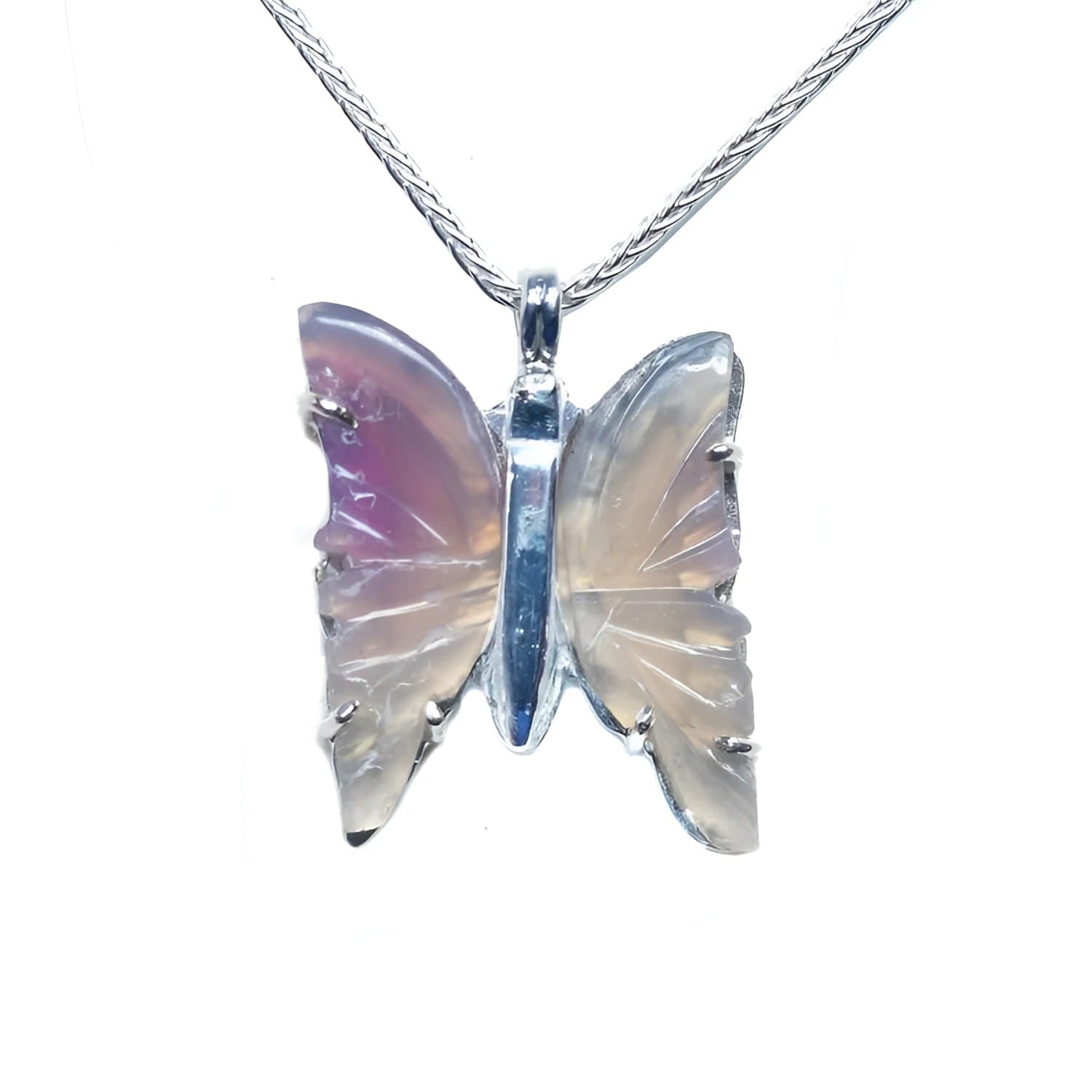 Lavender agate butterfly pendant with carved wings and sterling silver setting on a chain.