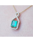 Lady's emerald jewelry necklace square emerald-cut, halo diamond 14k yellow gold