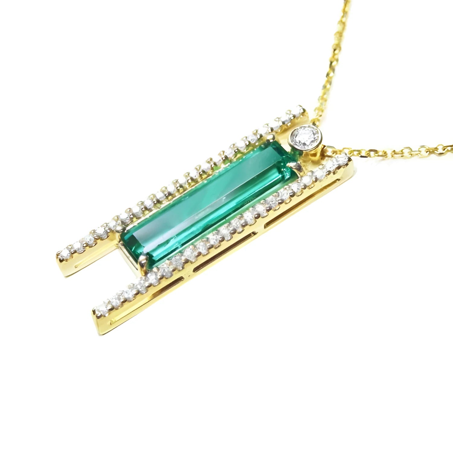 14K yellow gold necklace with a baguette-cut emerald, surrounded by natural diamonds, on a delicate chain.