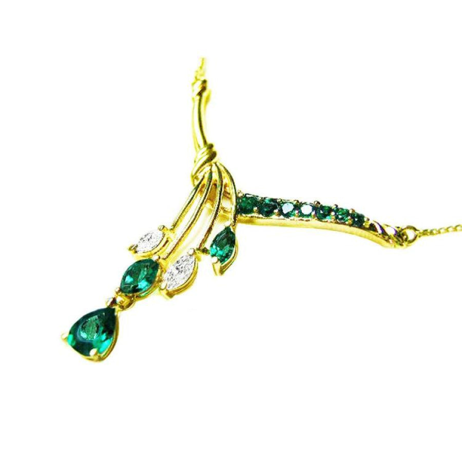 14K yellow gold necklace with marquise and pear-shaped Colombian emeralds and diamonds.