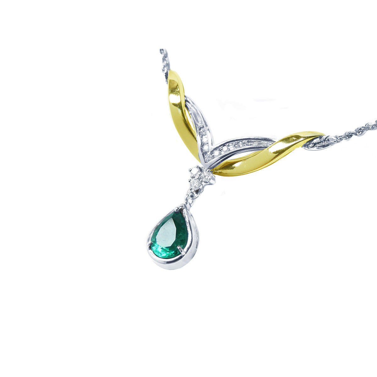left side angle of a pear cut solitaire emerald dangling from a necklace made in 14k white and yellow gold