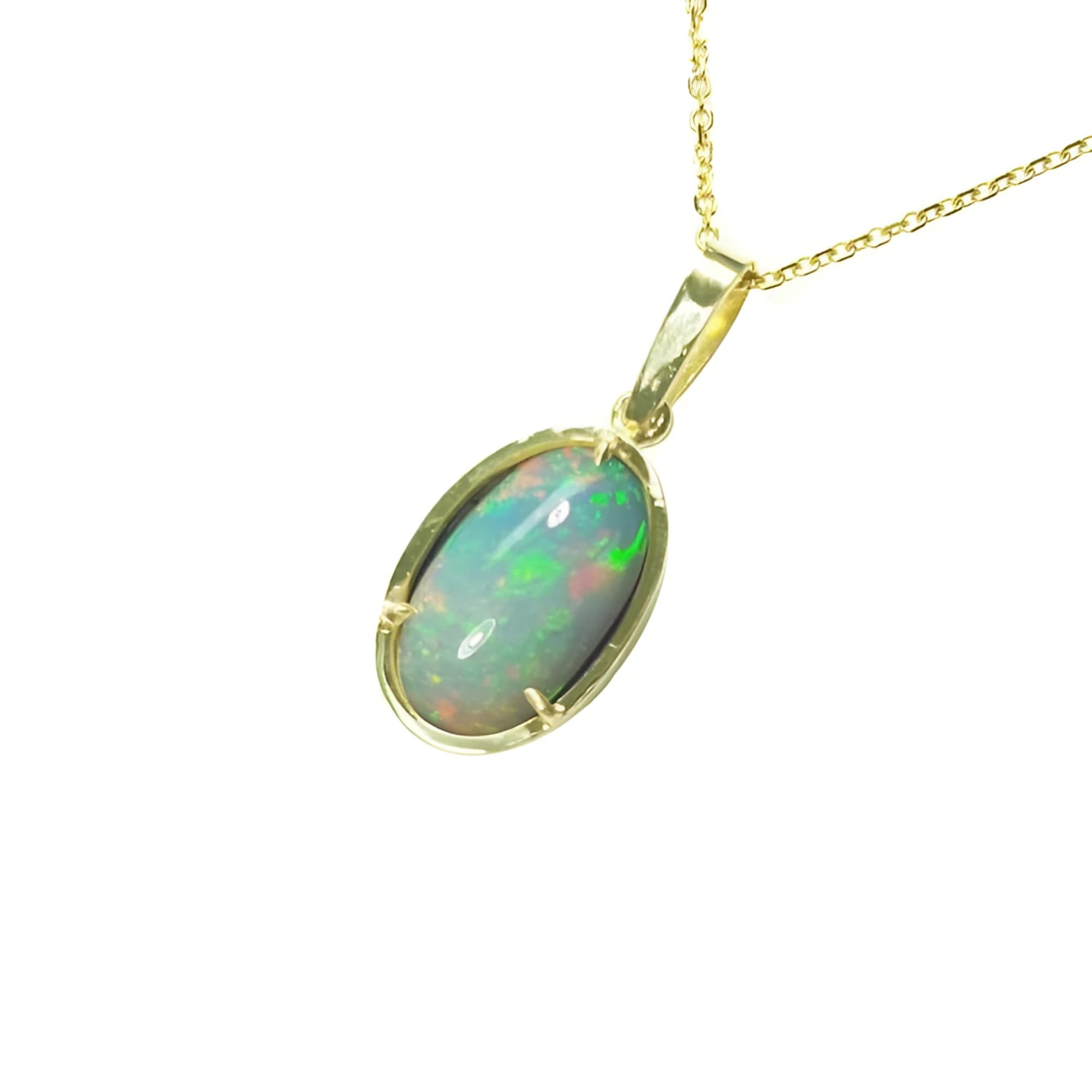Oval Ethiopian opal pendant with bluish-green hues, prong-set in 14K yellow gold on a delicate chain.