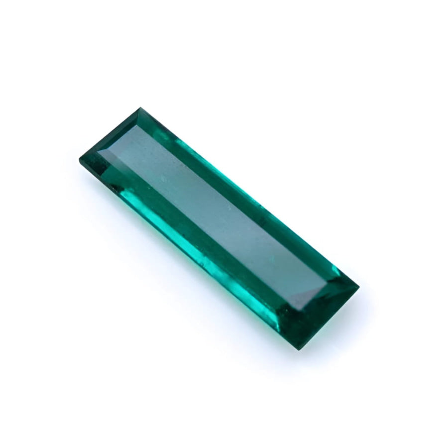 3.13 carat natural Colombian emerald, baguette cut, deep bluish-green, eye-clean.