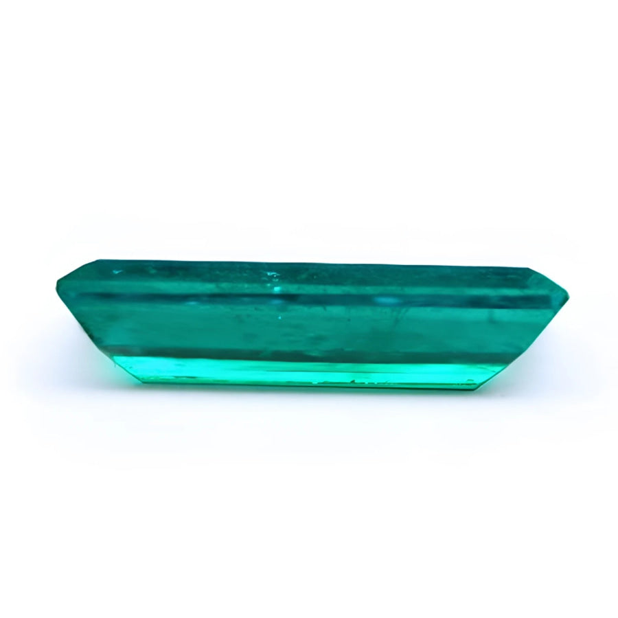 3.13 carat baguette cut Colombian emerald, sparkling bluish-green, eye-clean.