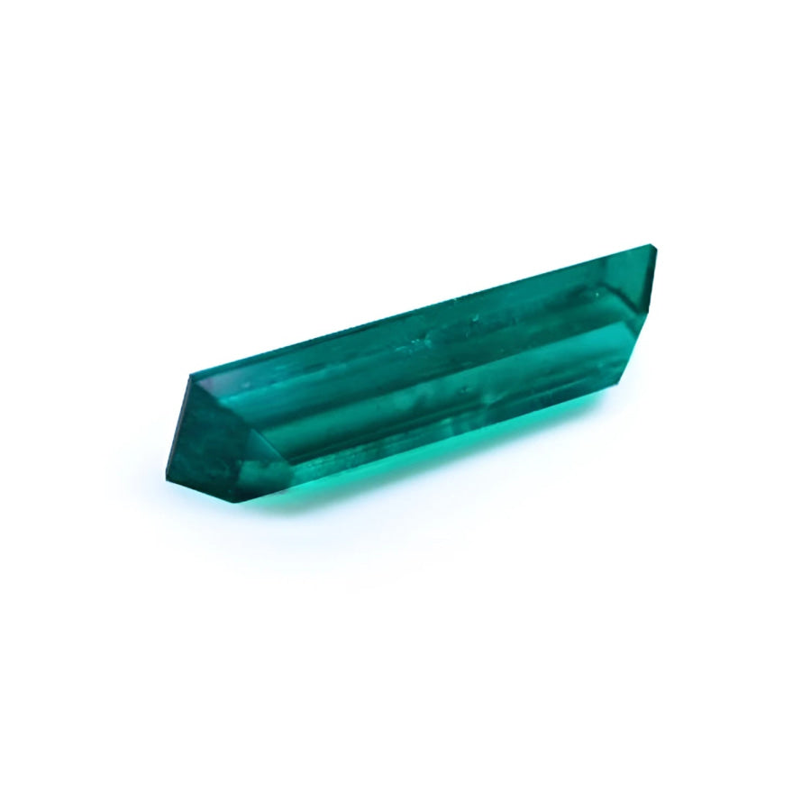 3.13 carat baguette cut Colombian emerald, eye-clean, sparkling bluish-green.