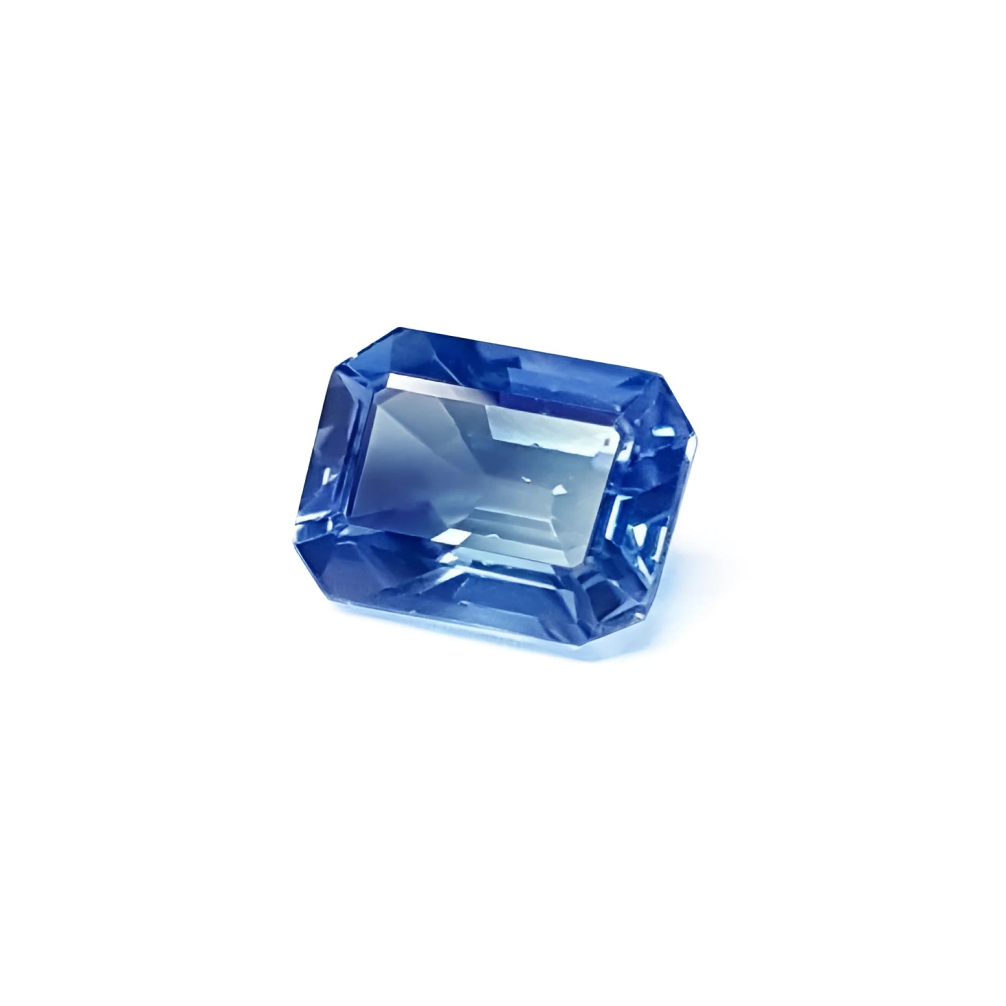 1.33 carats loose natural blue sapphire, with a dazzling rectangular emerald cut, is the perfect centerpiece for a luxurious ring.