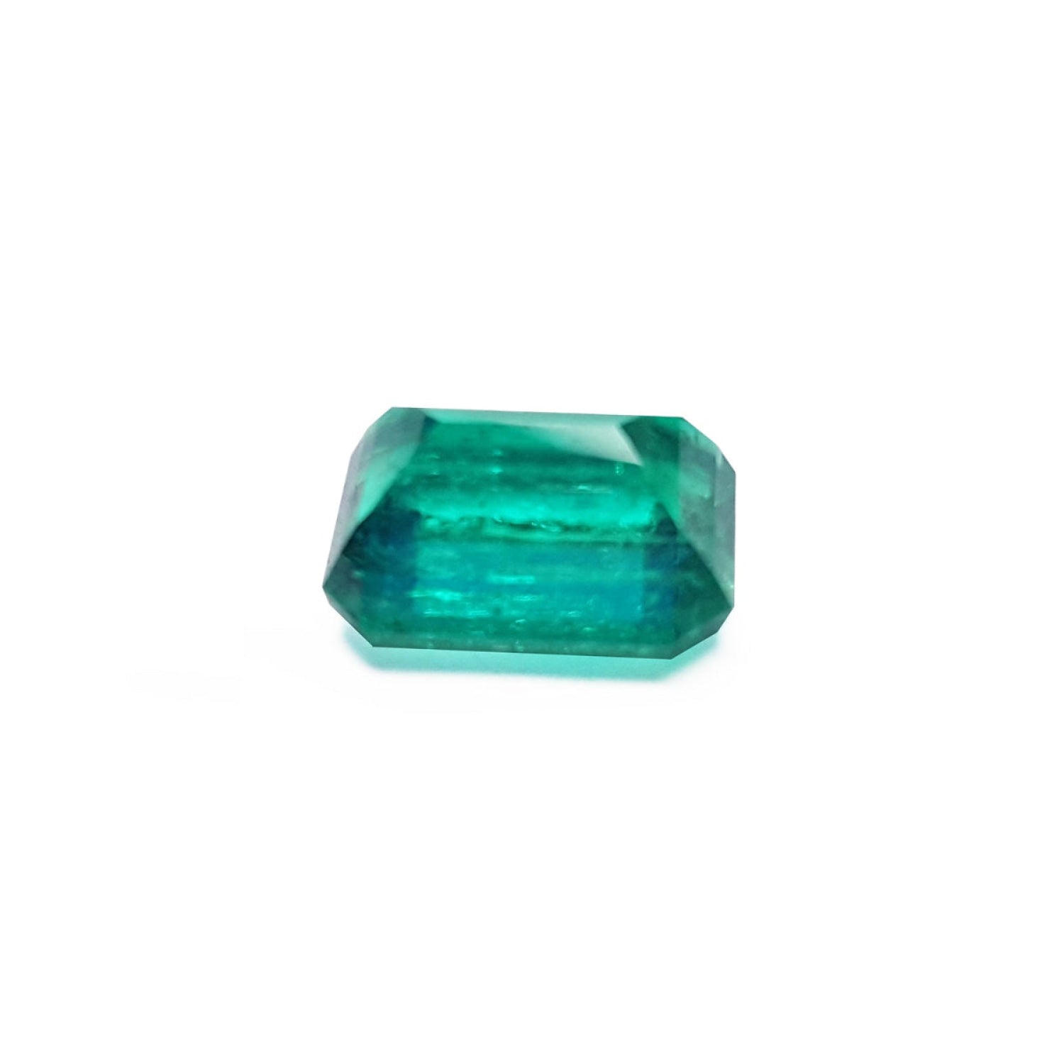 Vibrant bluish-green 4.18 carat emerald-cut loose emerald from Muzo, Colombia.