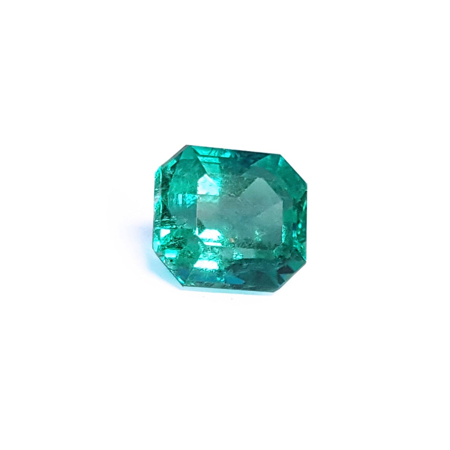4.71 carat emerald-cut Colombian emerald with a medium bluish-green hue.