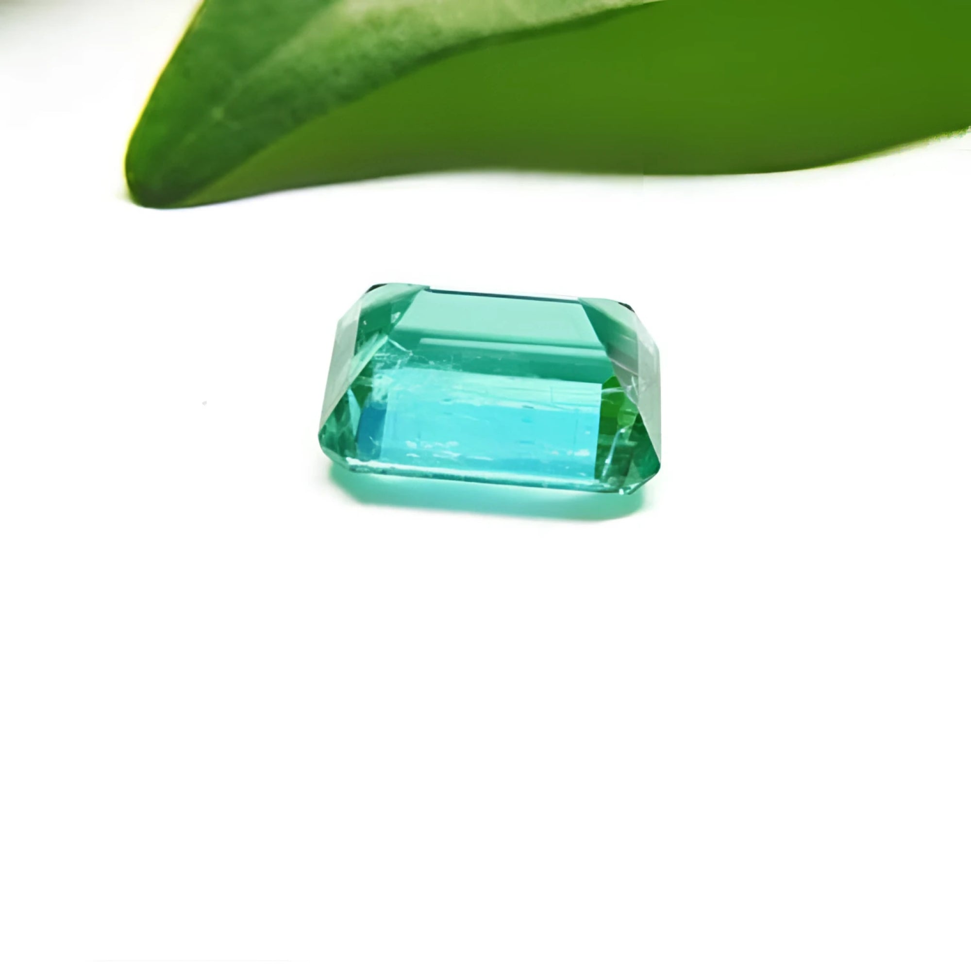 1.83 carat emerald-cut GIA certified Colombian emerald with a vibrant bluish-green hue.