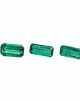 Loose emeralds matched trio set for earrings and pendant, left side tables and crowns visibles