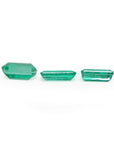 Loose emeralds matched trio set for earrings and pendant, undersides girdles and pavilions visibles
