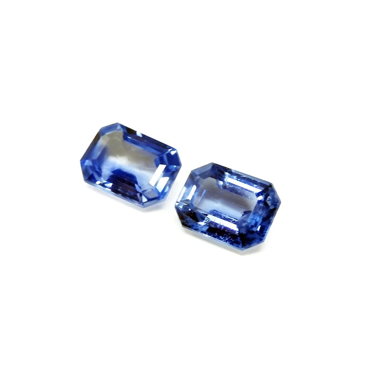 2.16 ct. loose matching pair of sparkling emerald-cut blue sapphires, ideal for earrings.