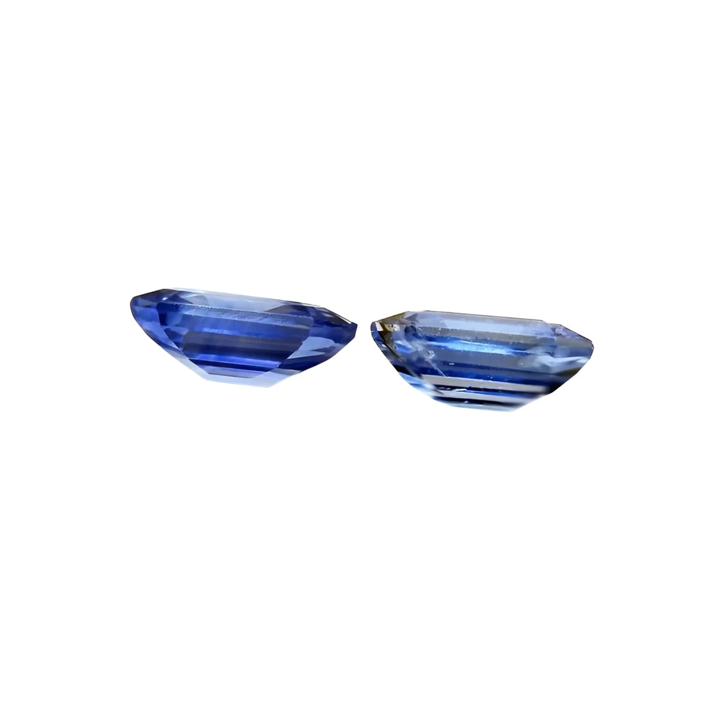 2.16 ct. loose matching pair of sparkling, medium light blue violet emerald-cut sapphires.