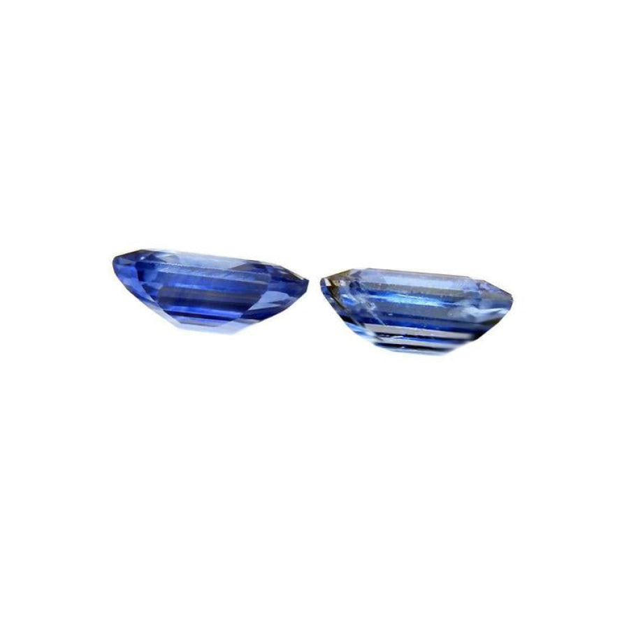 2.16 ct. loose matching pair of sparkling, medium light blue violet emerald-cut sapphires.