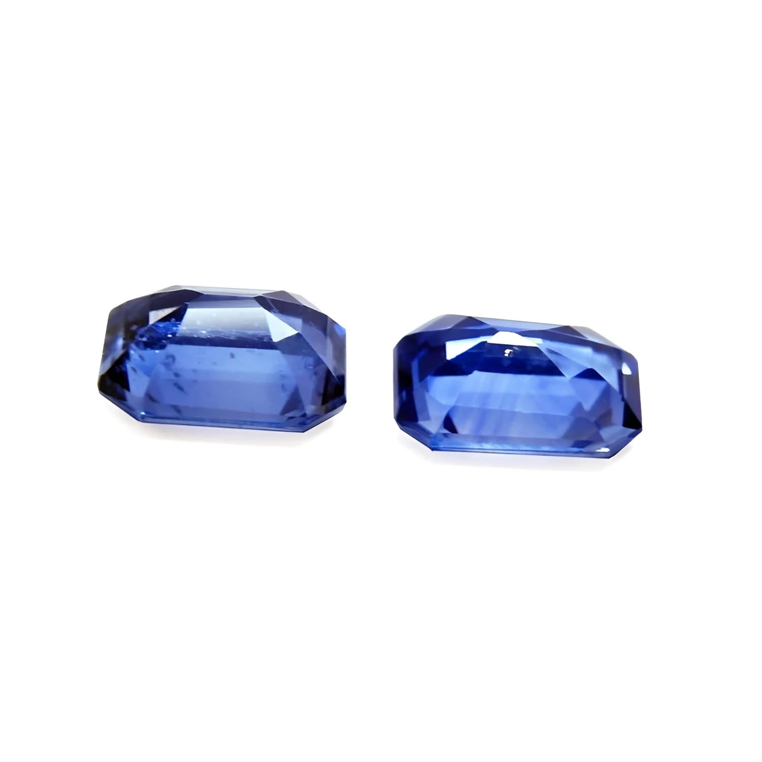 2.16 ct. loose matching pair of sparkling, medium light blue violet emerald-cut sapphires.