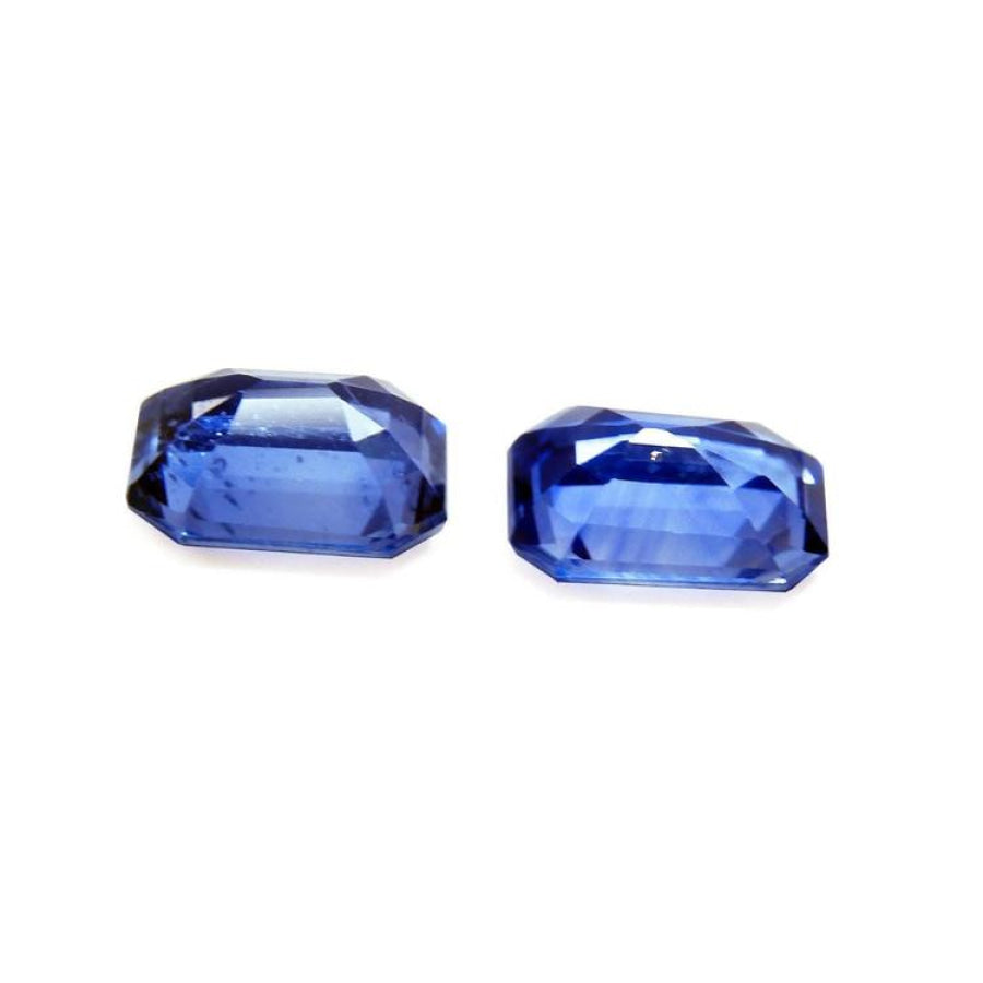 2.16 ct. loose matching pair of sparkling, medium light blue violet emerald-cut sapphires.