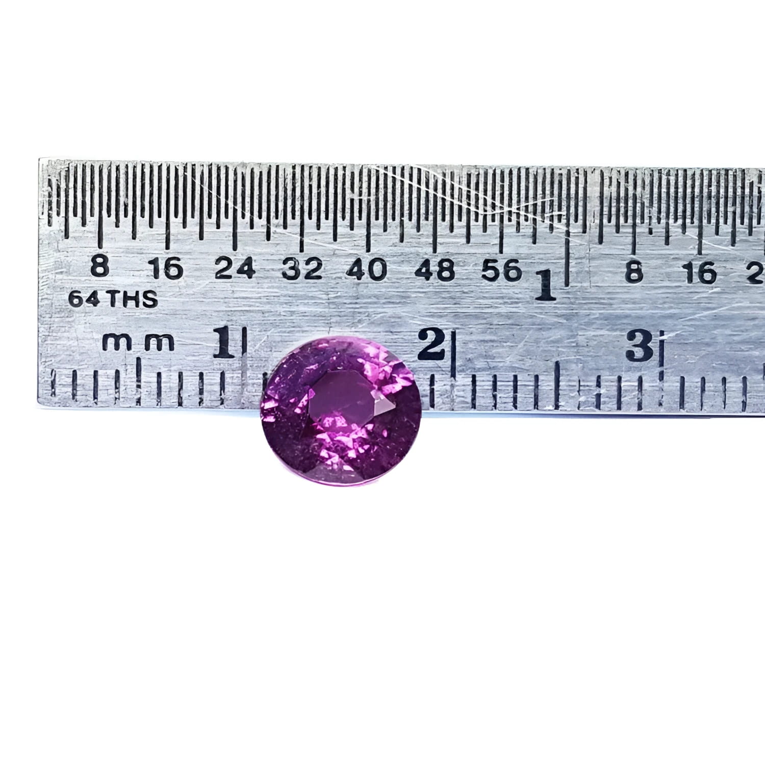 2.00 ct round cut natural pink sapphire loose stone with vibrant medium pink hue, shown against a ruler.