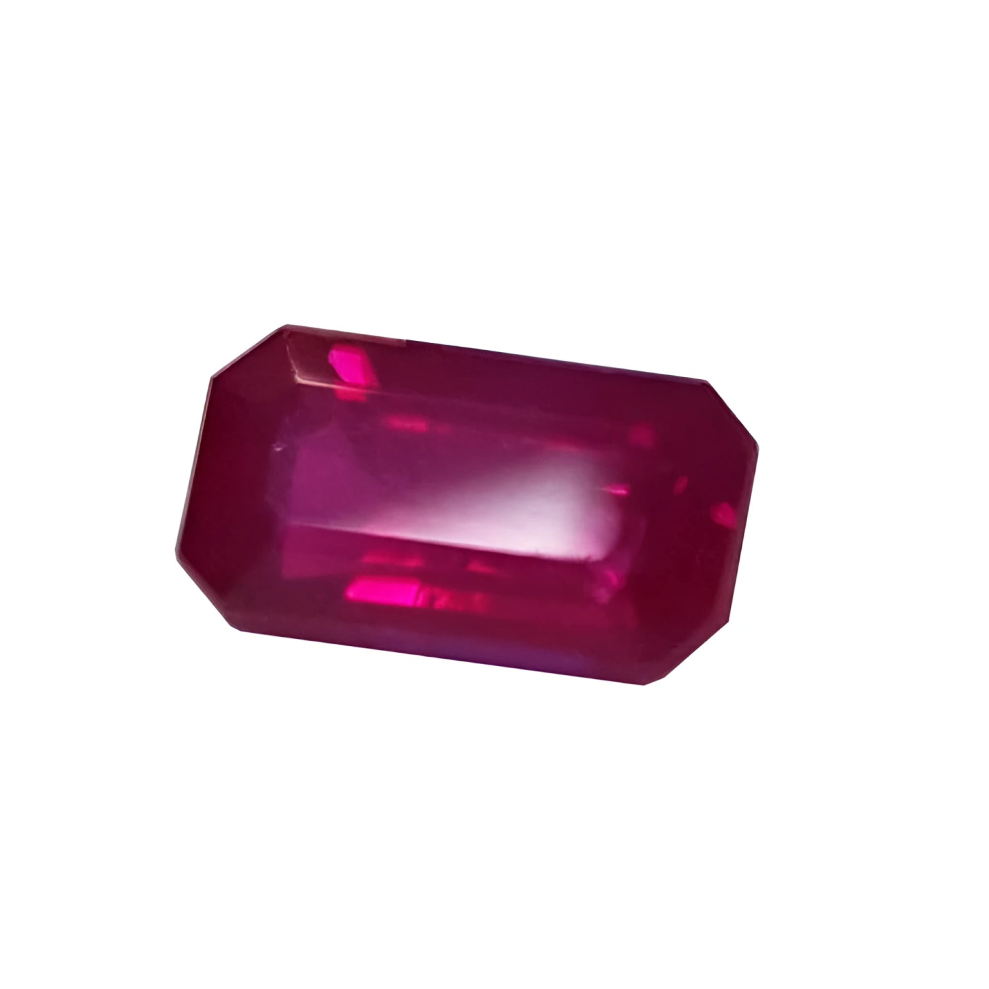 0.94 carat natural Burma ruby, emerald cut, deep red with brilliant facets.