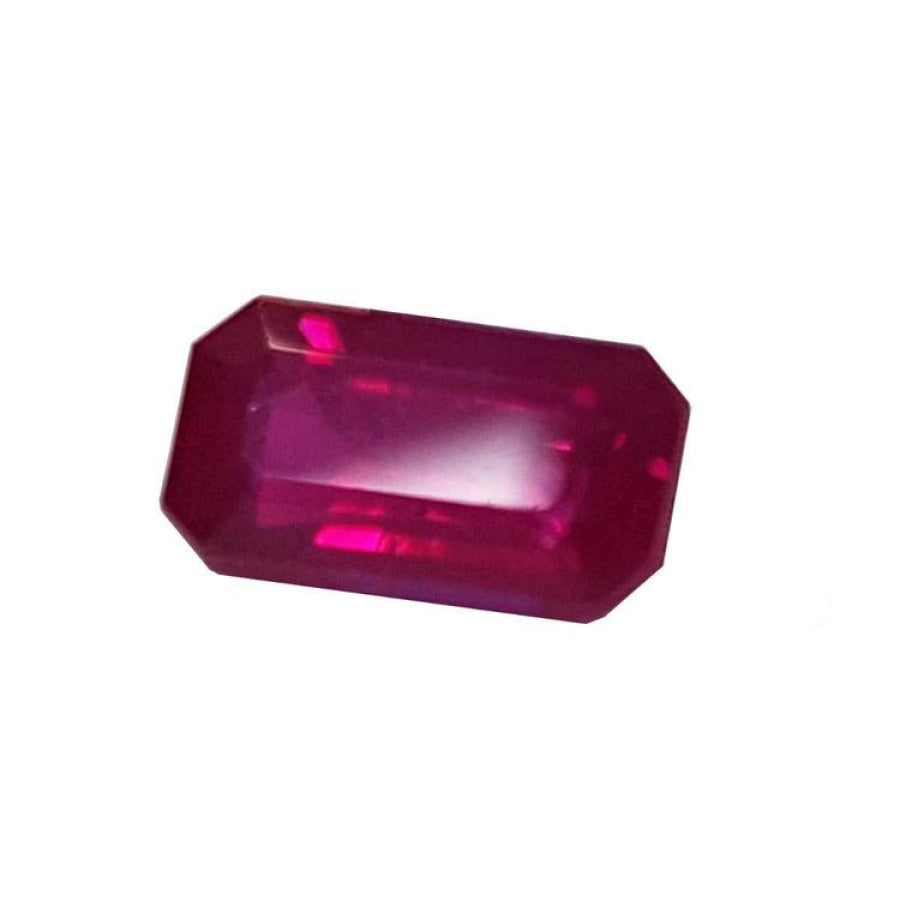 0.94 carat natural Burma ruby, emerald cut, deep red with brilliant facets.