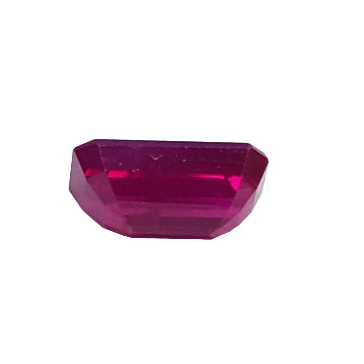 loose natural ruby emerald cut from Burma, underside position girdle and pavilion visibles