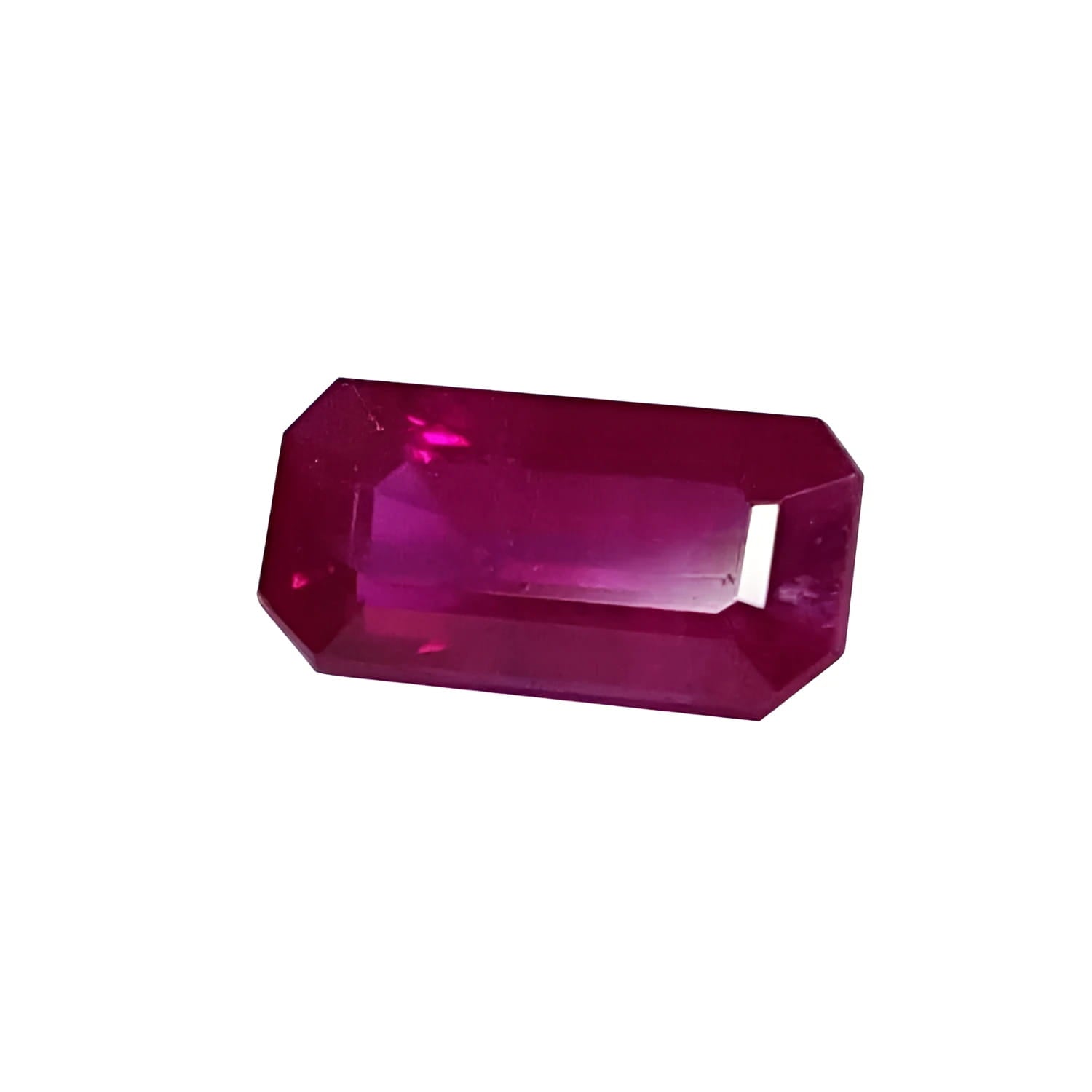 Sparkling 0.97 carat natural Burma ruby, rich red emerald cut, on a white background.