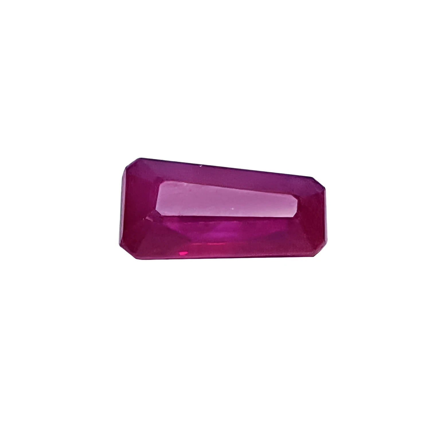 Deep red natural Burma ruby, 1.07 ct. tapered baguette cut, sparkling and crystalline.