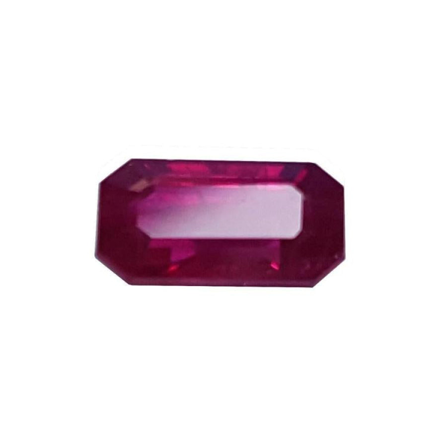 0.95 carat natural Burma ruby gemstone with a vibrant red hue and emerald cut.
