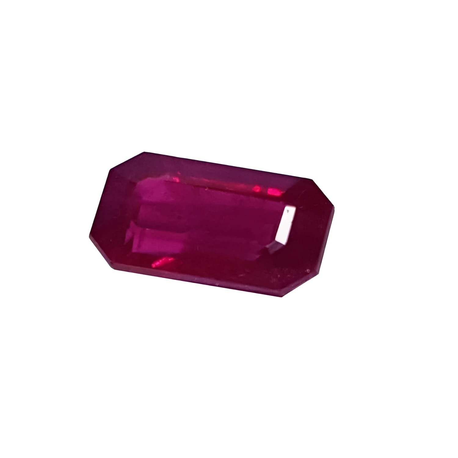 0.95 carat natural Burma ruby gemstone with a vibrant red color and emerald cut.