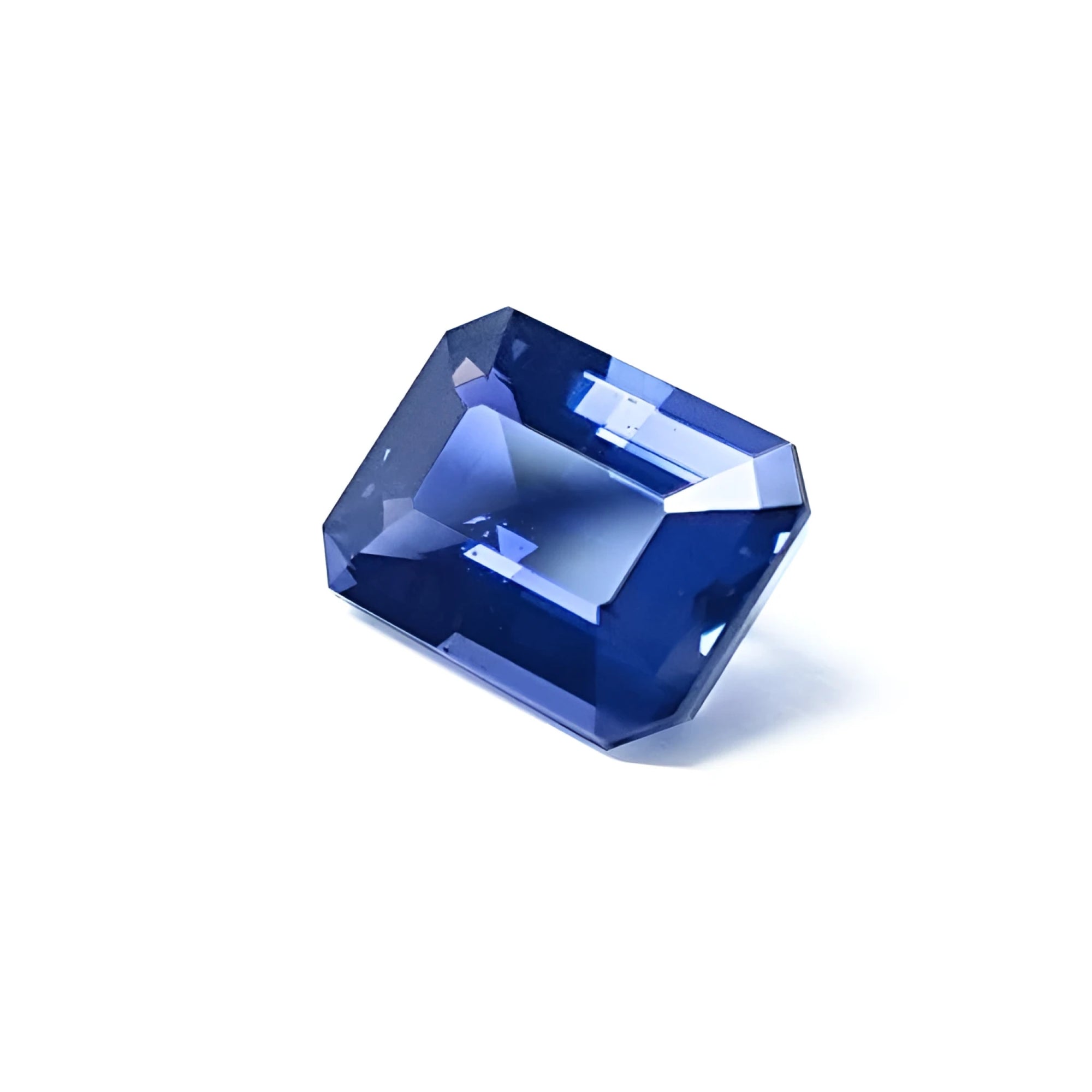 3.90 ct untreated GIA certified rectangular emerald-cut blue sapphire changing to purple.