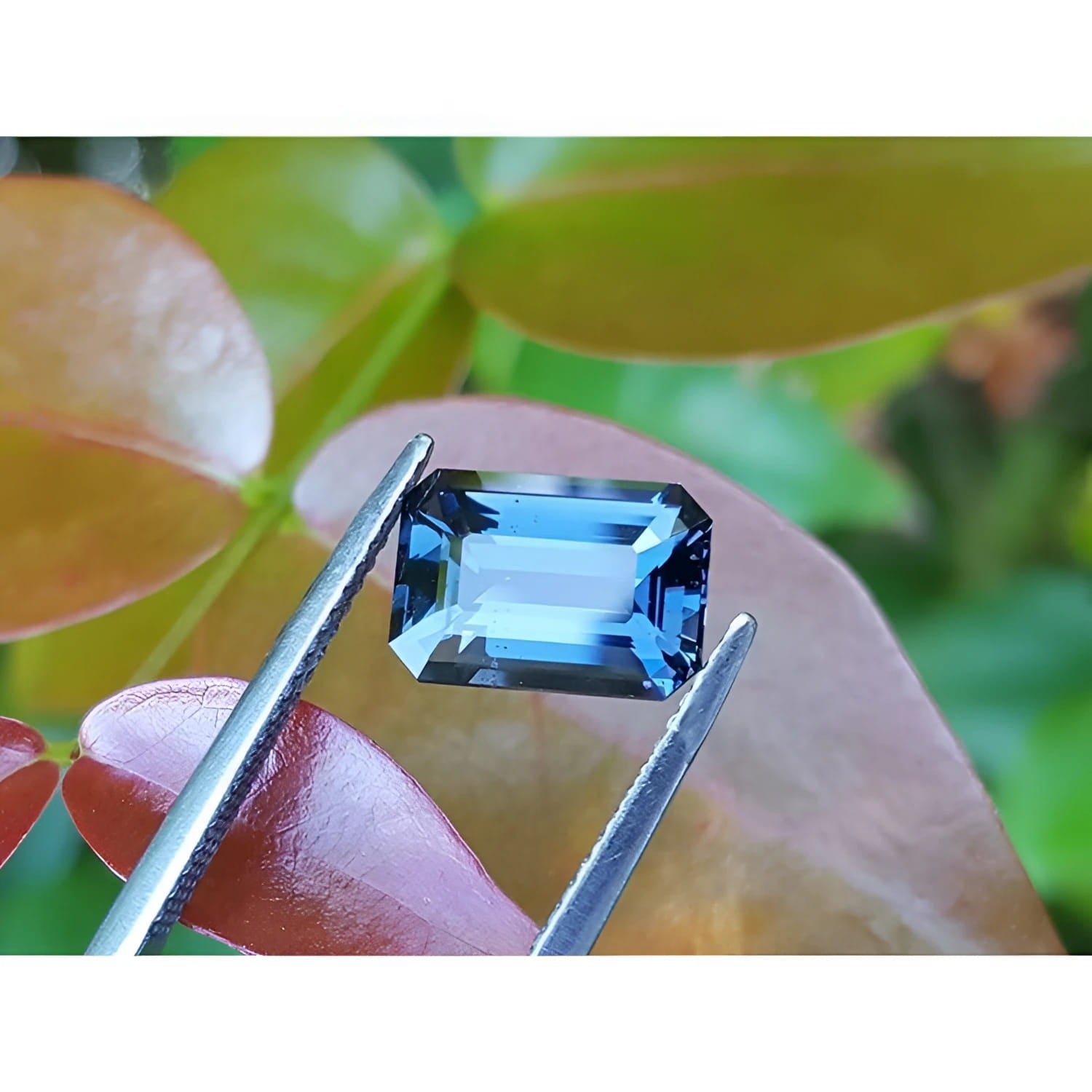 3.90 ct. untreated GIA certified sapphire, rectangular emerald-cut, blue changing to purple.