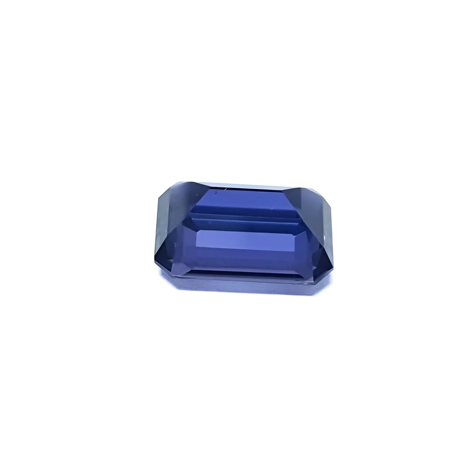 3.90 ct untreated GIA certified sapphire, rectangular emerald-cut, blue changing to purple.