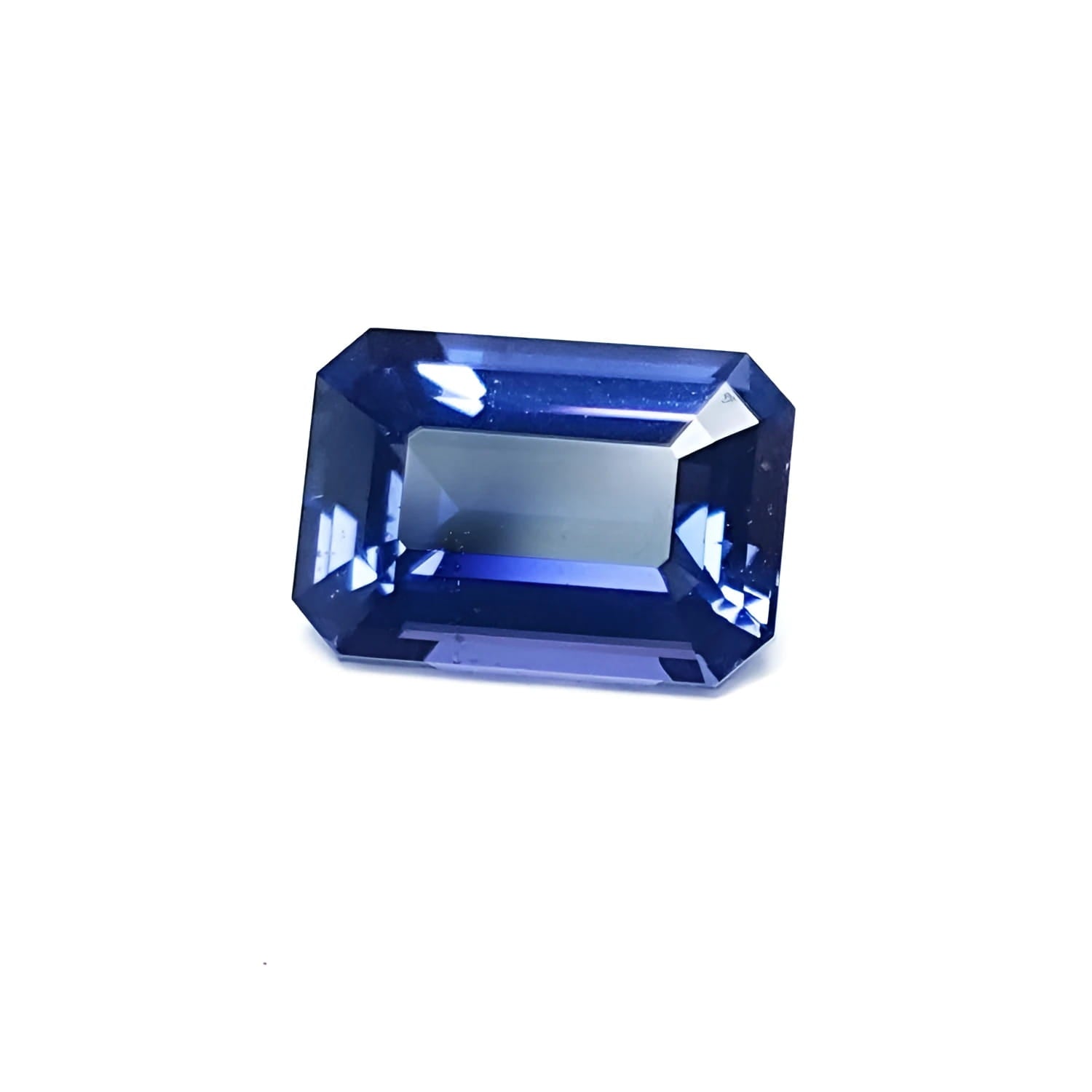 3.90 ct untreated GIA certified rectangular emerald-cut blue sapphire changing to purple.