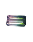 A rectangular emerald cut natural brazilian tourmaline displaying the topside table and crown faces.