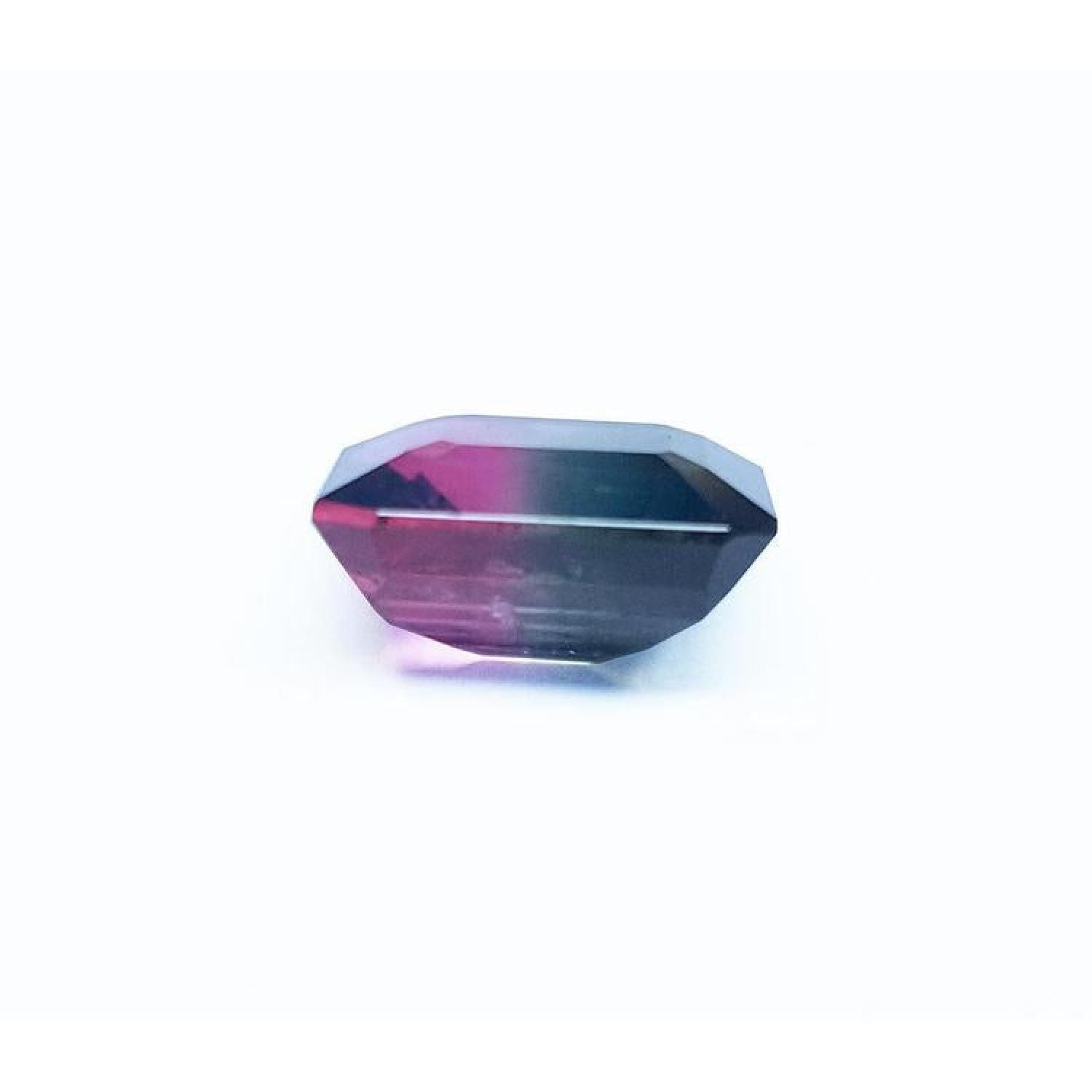 7.75 ct. emerald-cut Brazilian watermelon tourmaline gemstone with vibrant red-orange and deep bluish-green bicolor.
