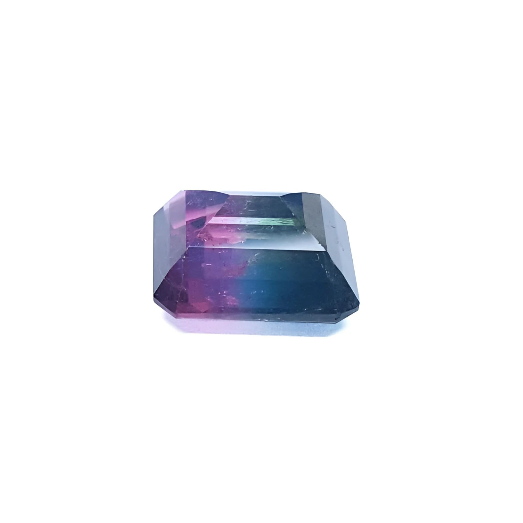 7.75 ct. emerald-cut Brazilian watermelon tourmaline gemstone with vibrant red-orange and deep bluish-green bicolor.