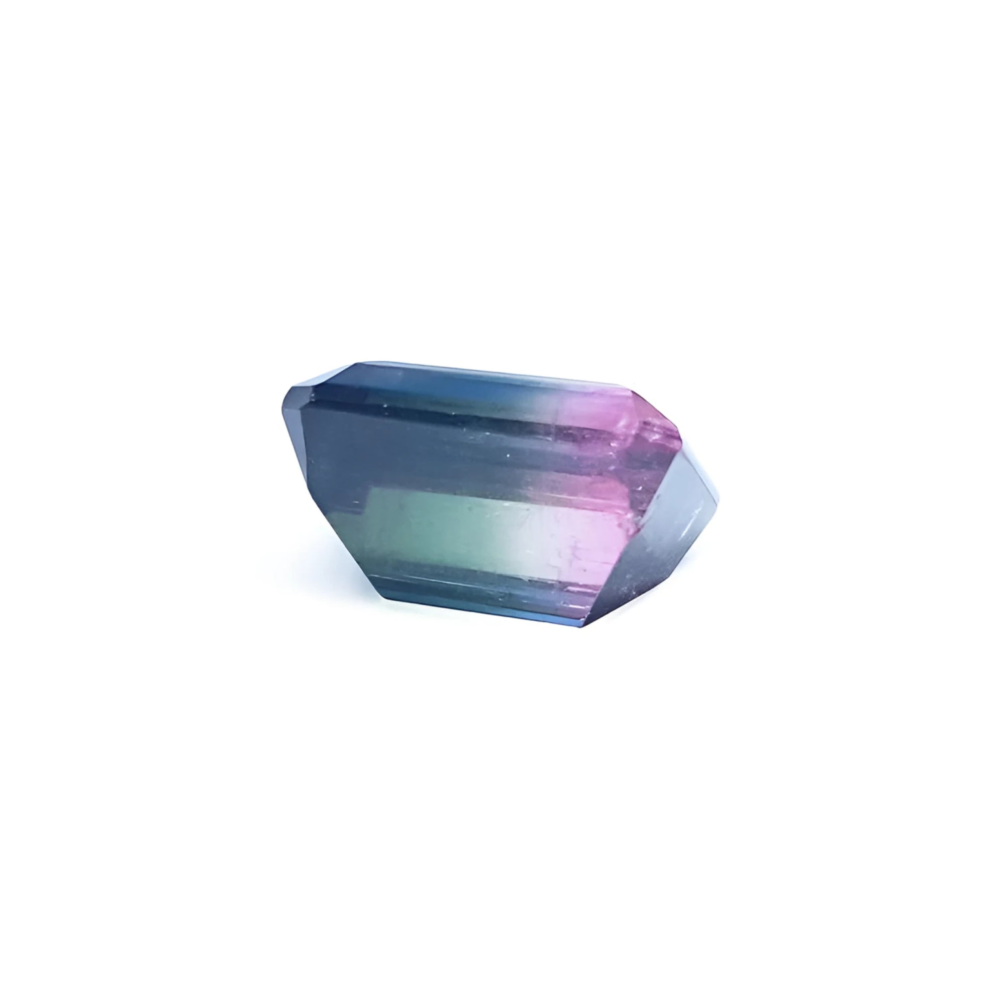 Loose 6.55 ct. emerald-cut Brazilian watermelon tourmaline, showing red, green, and blue hues.
