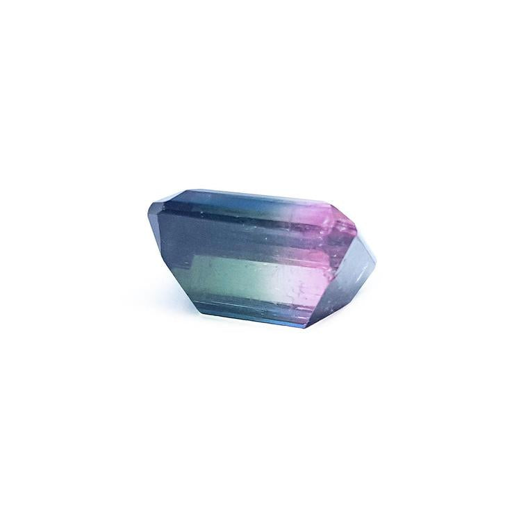 Loose 6.55 ct. emerald-cut Brazilian watermelon tourmaline, showing red, green, and blue hues.