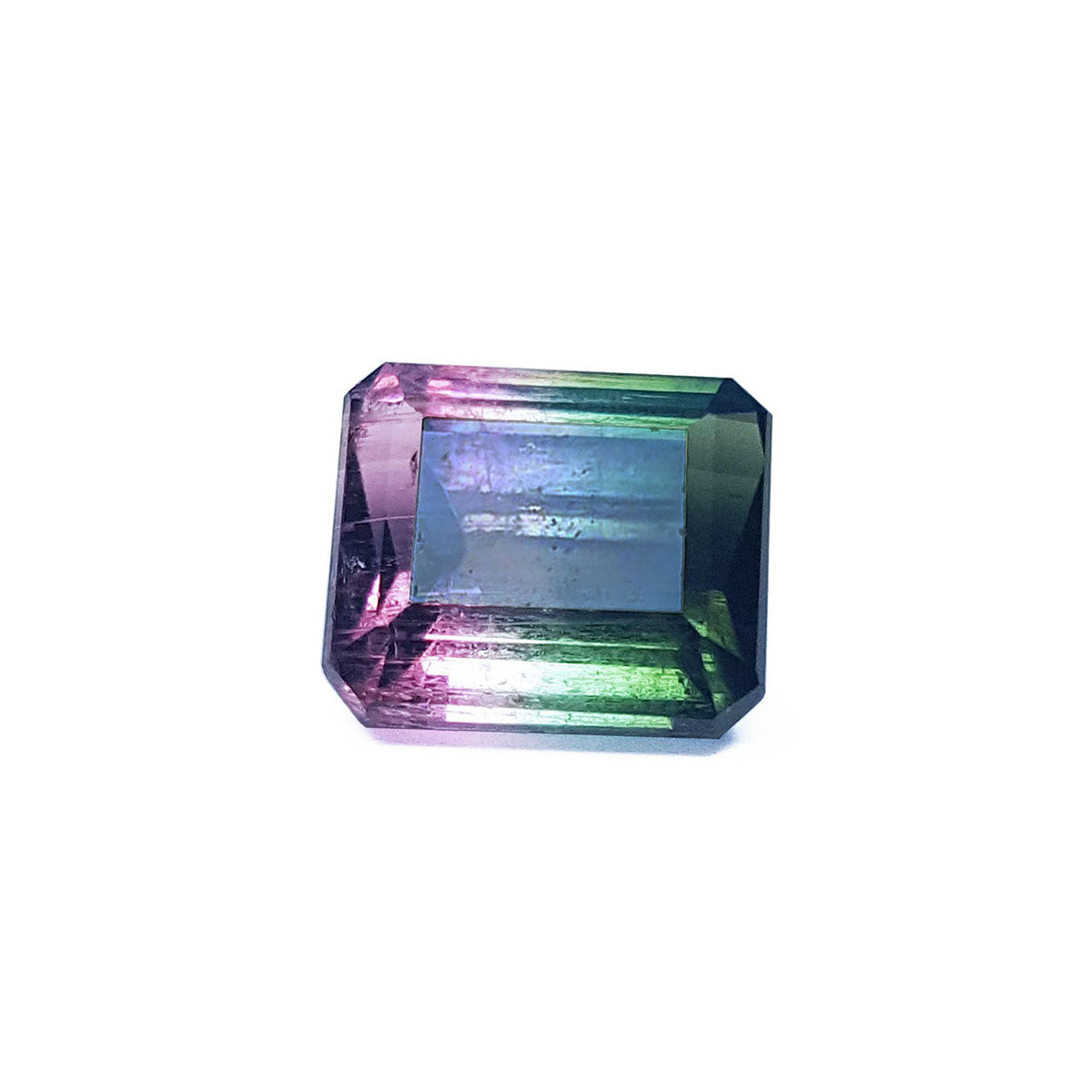 A natural watermelon tourmaline emerald cut from Brazil topside view, table and crown visibles.