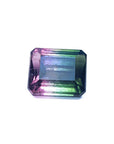 A natural watermelon tourmaline emerald cut from Brazil topside view, table and crown visibles.