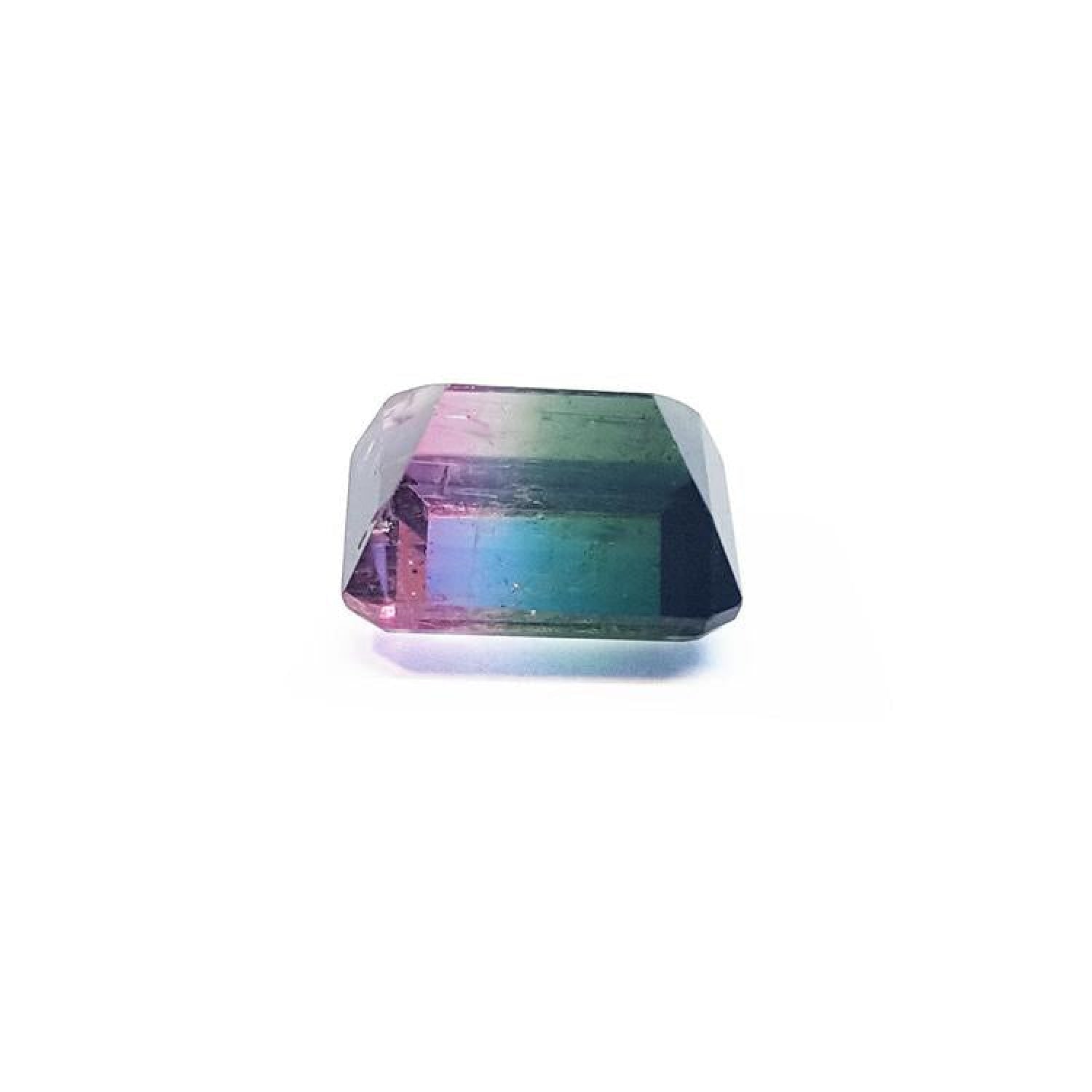 Loose 6.55 ct. emerald-cut watermelon tourmaline, showing red, green, and blue hues.